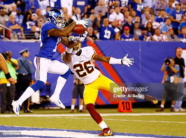 Odell Beckham of the New York Giants scores a touchdown against the defense of Bashaud Breeland of the Washington Redskins in the fourth quarter at...