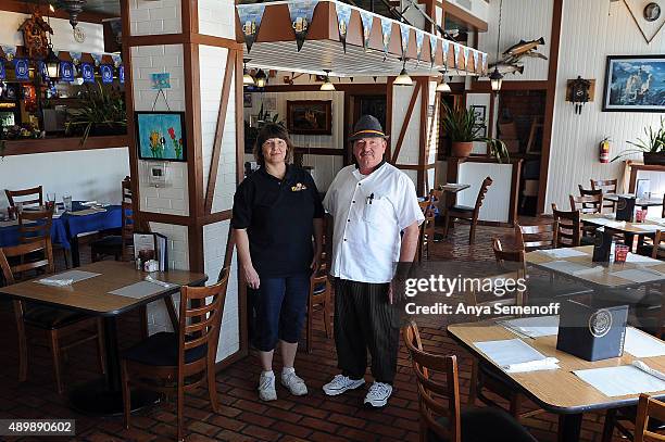 Helga and Herbert Huber, sibling co-owners of Helga's German Restaurant & Deli, pose for a portrait in the restaurant dining room on September 16 in...