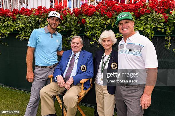 Dustin Johnson, left, and Charley Hoffman, right, pose with philanthropist Tom Cousins and his wife Ann before teeing off on the first hole during...