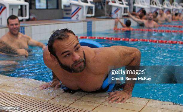 Brett Stewart does push ups during a Manly Sea Eagles NRL pool session at Warringah Aquatic Centre on May 13, 2014 in Sydney, Australia.