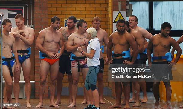 Manly players await instructions during a Manly Sea Eagles NRL pool session at Warringah Aquatic Centre on May 13, 2014 in Sydney, Australia.