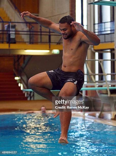 Dunamis Lui jumps into the water during a Manly Sea Eagles NRL pool session at Warringah Aquatic Centre on May 13, 2014 in Sydney, Australia.
