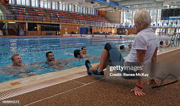 Manly Players listen to the instructor during a Manly Sea Eagles NRL pool session at Warringah Aquatic Centre on May 13, 2014 in Sydney, Australia.