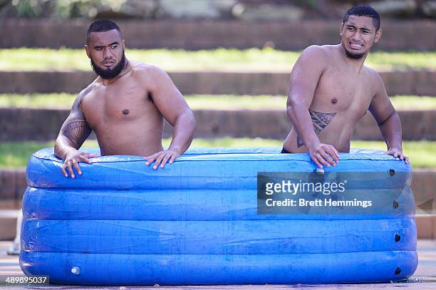 Junior Paulo and Pauli Pauli of the Eels cool off in a ice bath during a Parramatta Eels NRL recovery session at Pirtek Stadium on May 13, 2014 in...