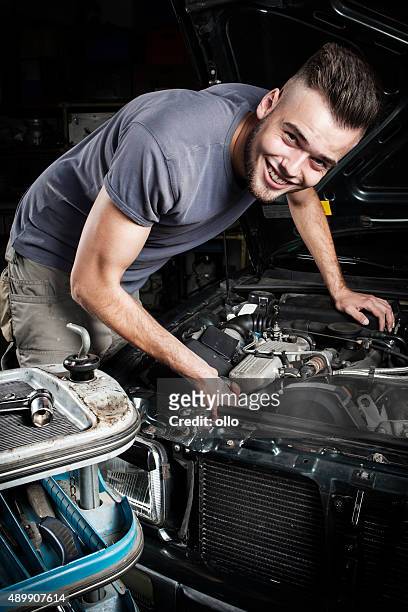 mechanic car repair engine motor - car hood stock pictures, royalty-free photos & images