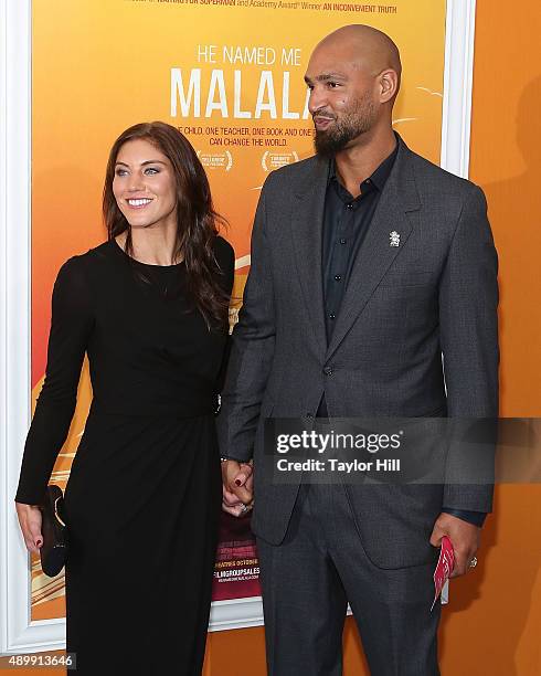 Hope Solo and Jerramy Stevens attend the "He Named Me Malala" premiere at Ziegfeld Theater on September 24, 2015 in New York City.