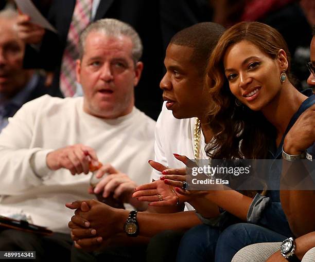 Jay-Z and Beyonce attend Game Four of the Eastern Conference Semifinals during the 2014 NBA Playoffs at the Barclays Center on May 12, 2014 in the...