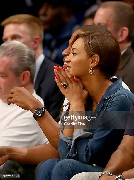 Jay-Z and Beyonce attend Game Four of the Eastern Conference Semifinals during the 2014 NBA Playoffs at the Barclays Center on May 12, 2014 in the...