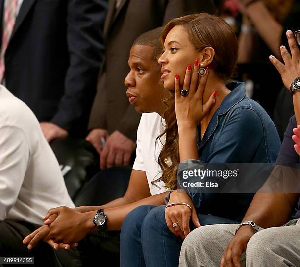 Jay-Z and Beyonce attend Game Four of the Eastern Conference Semifinals during the 2014 NBA Playoffs at the Barclays Center on May 12, 2014 in the...