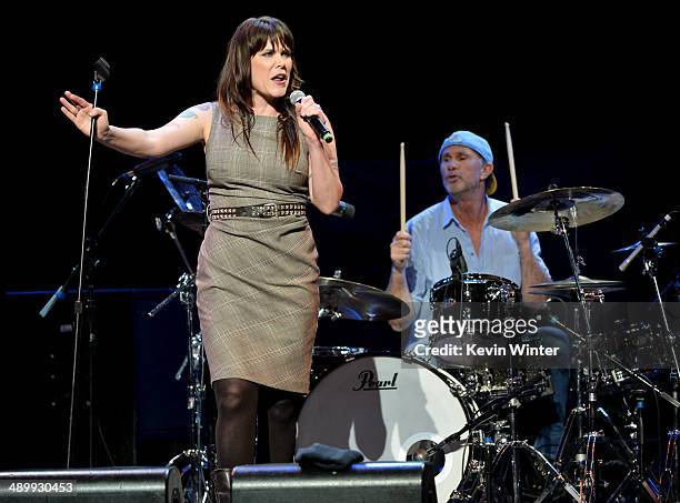 Singer/songwriter Beth Hart and drummer Chad Smith perform onstage at the 10th annual MusiCares MAP Fund Benefit Concert to raise funds for...