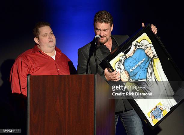 Comedian Ralphie May and Honoree Rob Beckham of WME speak onstage during the T.J. Martell Ambassador Of The Year Awards at The Rosewall on May 12,...