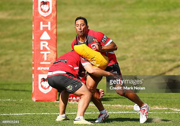 Benji Marshall takes part in a defensive drill during a St George Illawarra Dragons NRL training session at WIN Stadium on May 13, 2014 in...