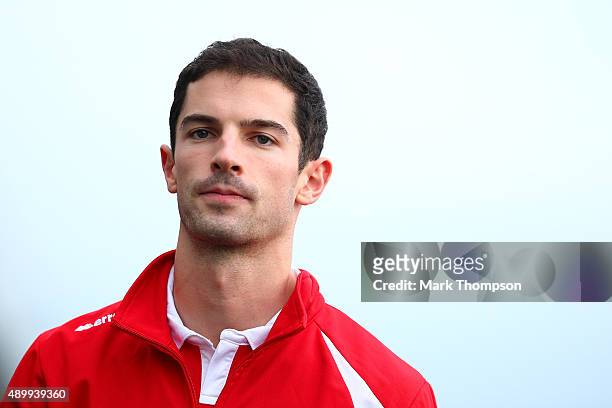 Alexander Rossi of the United States and Manor Marussia walks in the paddock during practice for the Formula One Grand Prix of Japan at Suzuka...