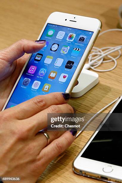 Customer checks the new iPhone 6s displayed at the Apple Store Opera on September 25, 2015 in Paris, France. Apple launched the new iPhone 6s and...