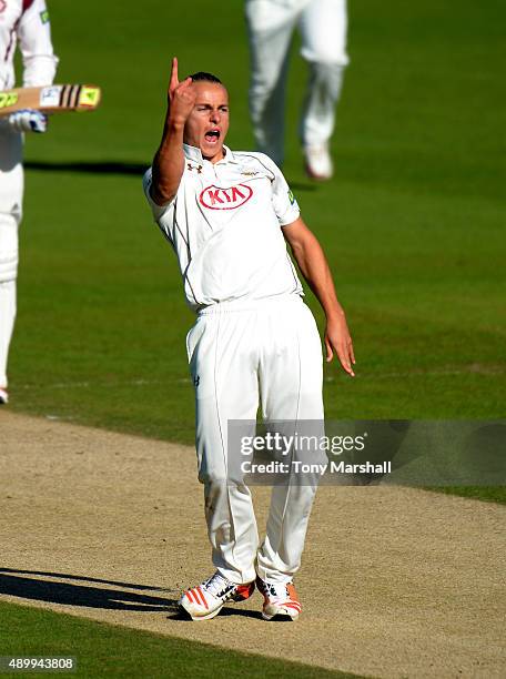 Tom Curran of Surrey celebrates dismissing Ben Duckett of Northamptonshire during the LV County Championship - Division Two match between Surrey and...