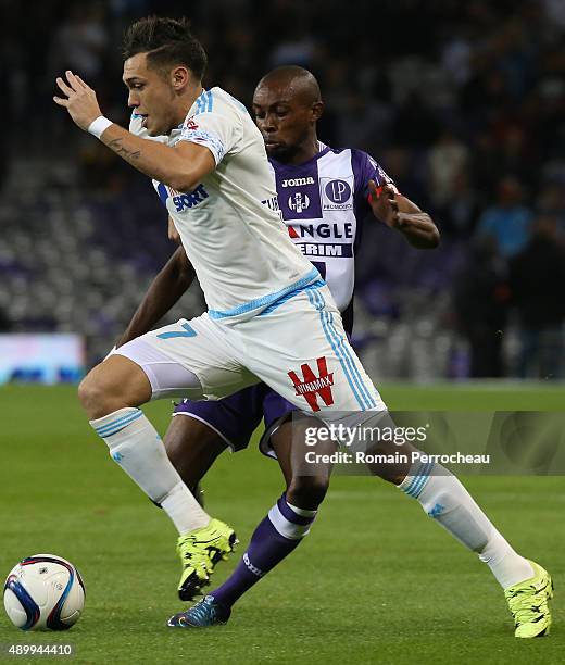 Lucas Ocampos for Olympique de Marseille and Jean Daniel Akpa Akpro battle for the ball during the French Ligue 1 game between Toulouse FC and...