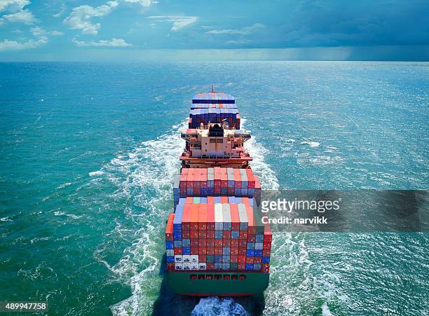 aerial view of freight ship with cargo containers - container stock pictures, royalty-free photos & images