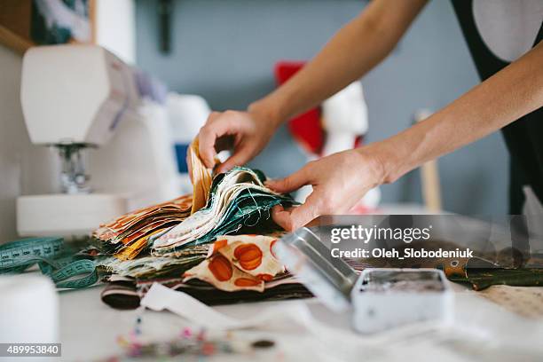 tailor working on sewing machine - design occupation stock pictures, royalty-free photos & images