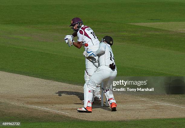 Gary Wilson of Surrey stretches to catch the ball from David Murphy of Northamptonshire during the LV County Championship - Division Two match...