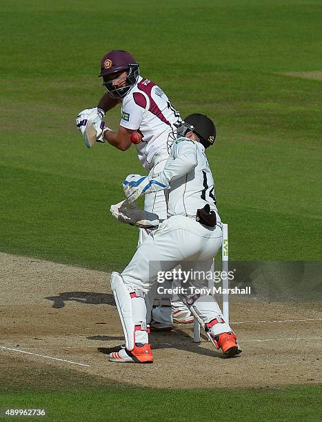 Gary Wilson of Surrey stretches to catch the ball from David Murphy of Northamptonshire during the LV County Championship - Division Two match...