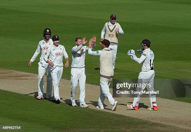 Garteth Batty of Surrey celebrates taking the wicket of Josh Cobb of Northamptonshire during the LV County Championship - Division Two match between...