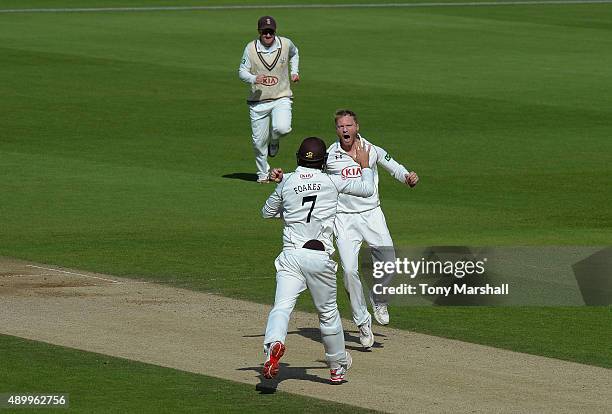 Ben Foakes of Surrey celebrates catching Josh Cobb of Northamptonshire with Gareth Batty of Surrey during the LV County Championship - Division Two...