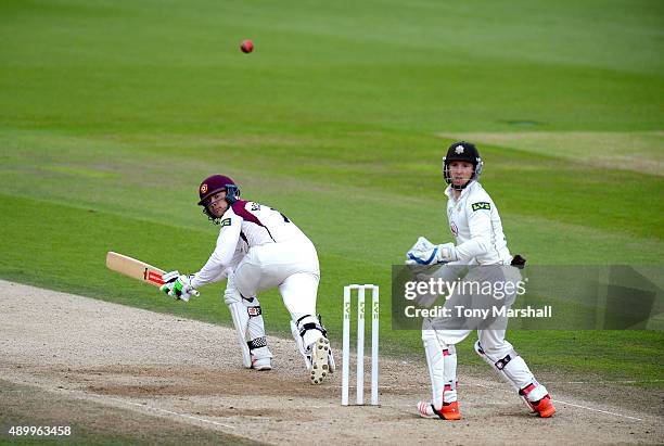 Adam Rossington of Northamptonshire hits a shot past Gary Wilson of Surrey during the LV County Championship - Division Two match between Surrey and...