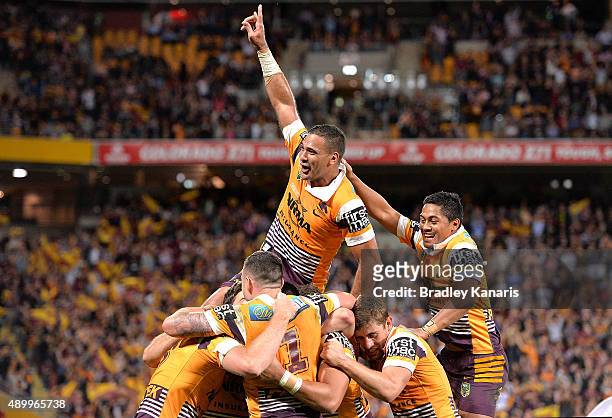 Justin Hodges of the Broncos and team mates are seen celebrating a try by Jack Reed during the NRL First Preliminary Final match between the Brisbane...