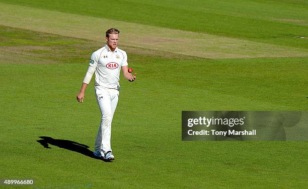 Matt Dunn of Surrey prepares to bowl during the LV County Championship - Division Two match between Surrey and Northamptoshire at The Kia Oval on...