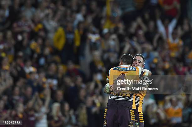 Corey Parker of the Broncos celebrates victory with Justin Hodges during the NRL First Preliminary Final match between the Brisbane Broncos and the...