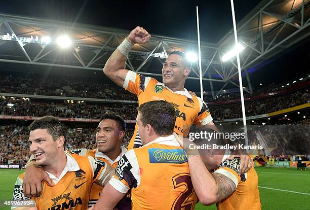 Justin Hodges of the Broncos and team mates celebrate victory after the NRL First Preliminary Final match between the Brisbane Broncos and the Sydney...