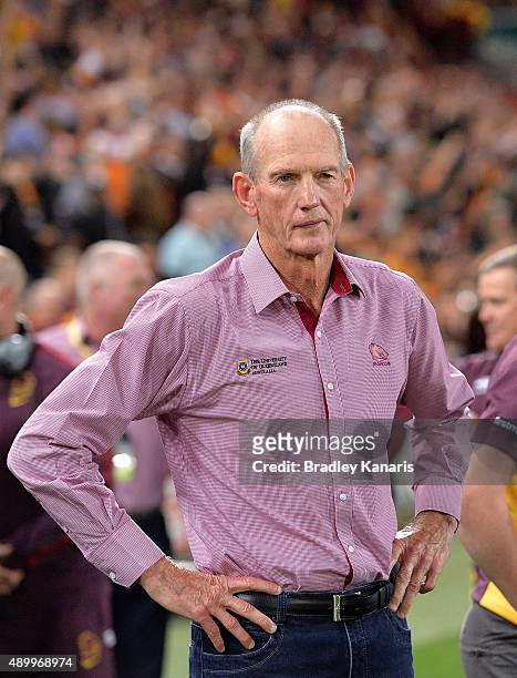 Coach Wayne Bennett watches on as his team celebrates victory after the NRL First Preliminary Final match between the Brisbane Broncos and the Sydney...