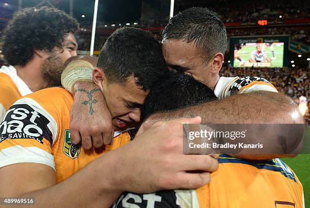 Jordan Kahu, Justin Hodges and Anthony Milford of the Broncos celebrate victory after the NRL First Preliminary Final match between the Brisbane...