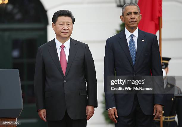 President Barack Obama stands with Chinese president Xi Jinping after arriving at the White House September 25, 2015 in Washington, DC. President...