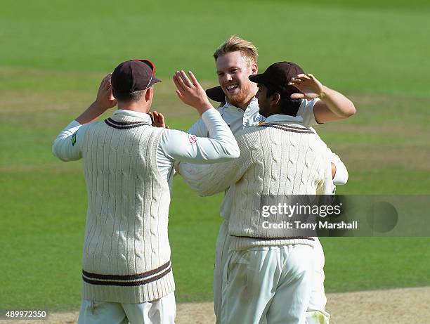 Matt Dunn of Surrey celebrates taking the wicket of Adam Rossington of Northamptonshire during the LV County Championship - Division Two match...