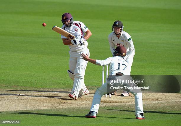 David Murphy of Northamptonshire hits a shot past Rory Burns of Surrey during the LV County Championship - Division Two match between Surrey and...