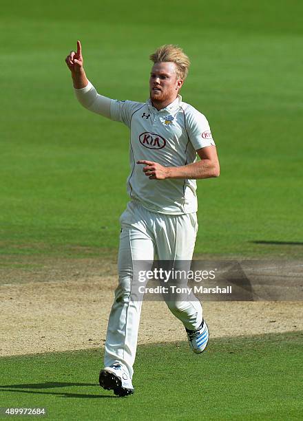 Matt Dunn of Surrey celebrates taking the wicket of Graeme White of Northamptonshire during the LV County Championship - Division Two match between...
