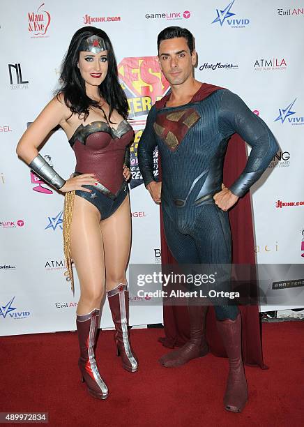 Adult film actors Kimberly Kane as Wonder Woman and Ryan Driller as Superman at FSC After Dark "Capes & Panties" A Superhero Costume & Lingerie...