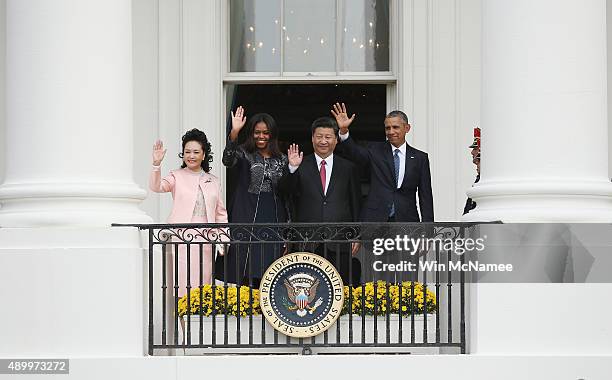 President Barack Obama and First Lady Michelle Obama wave with Chinese President Xi Jinping and First Lady Peng Liyuan at the White House September...