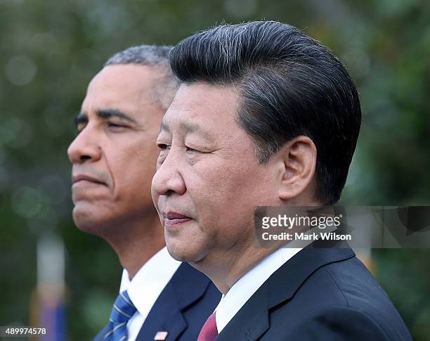 President Barack Obama and Chinese president Xi Jinping stand together during arrival ceremony at the White House September 25, 2015 in Washington,...