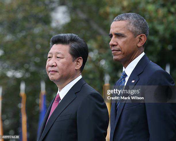 President Barack Obama and Chinese president Xi Jinping stand together during arrival ceremony at the White House September 25, 2015 in Washington,...