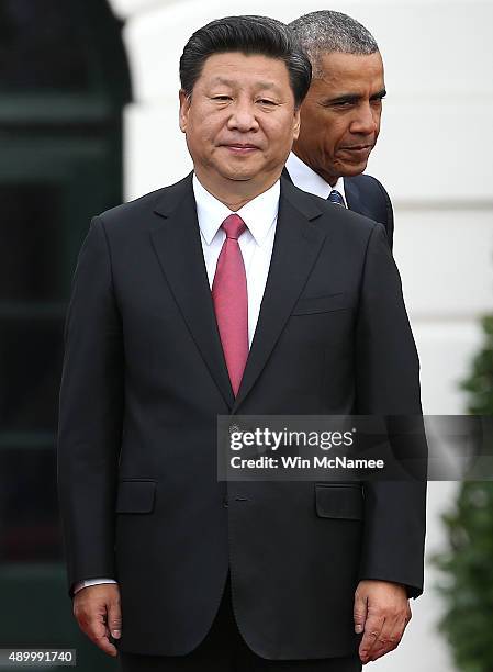 President Barack Obama and Chinese President Xi Jinping participate in a state arrival ceremony on the south lawn of the White House grounds...