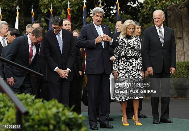 Secretary of Defense Ashton Carter, Treasury Secretary Jack Lew, Secretary of State John Kerry and US Vice President Joe Biden with his wife Jill...