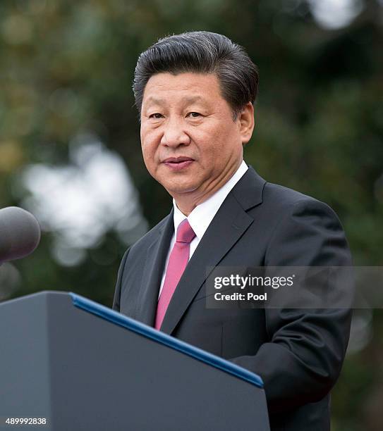 President XI Jinping of China participates in an arrival ceremony during an official State Visit on the south lawn of the White House grounds...