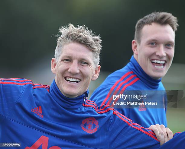 Bastian Schweinsteiger and Phil Jones of Manchester United in action during a first team training session at Aon Training Complex on September 25,...