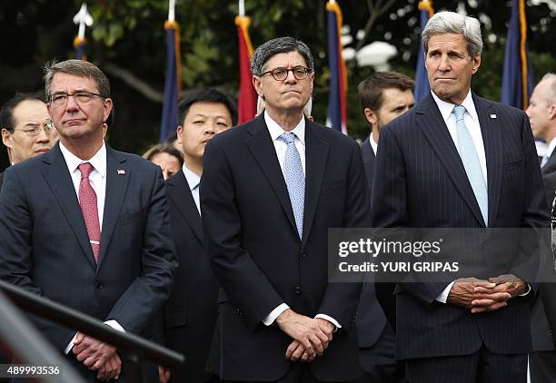 Secretary of Defense Ash Carter, Treasury Secretary Jack Lew and Secretary of State John Kerry wait to welcome Chinese President Xi Jinping to the...