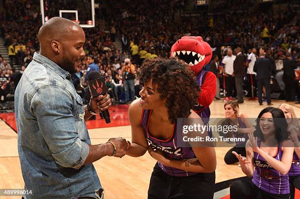 Latoya Robinson of the Raptors Dance Pak is proposed to during the Los Angeles Lakers and Toronto Raptors game on March 27, 2015 at Verizon Center in...