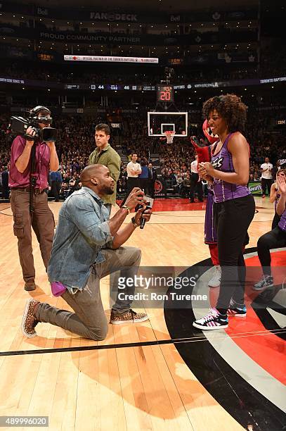 Latoya Robinson of the Raptors Dance Pak is proposed to during the Los Angeles Lakers and Toronto Raptors game on March 27, 2015 at Verizon Center in...