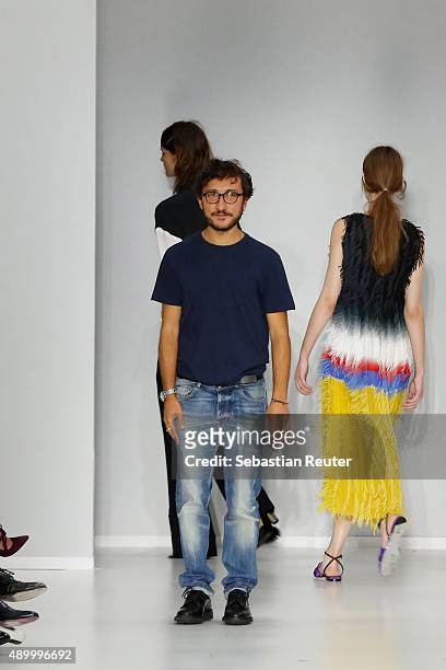 Italian Designer Marco de Vincenzo acknowledges the applause of the public afterg the Marco De Vincenzo fashion show as part of Milan Fashion Week...