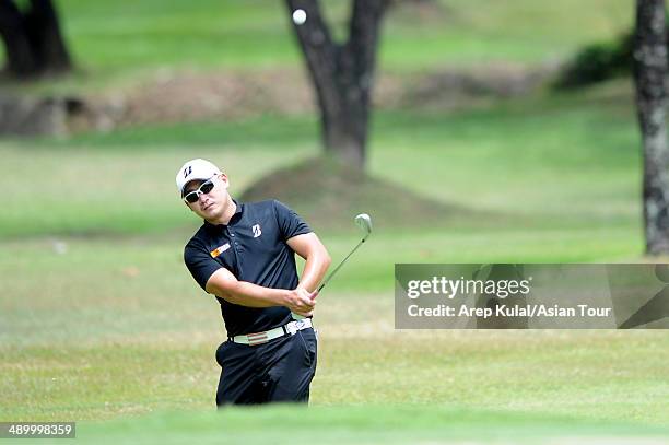 Angelo Que of Philippines plays a shot during practice ahead of the ICTSI Philippine Open at Wack Wack Golf and Country Club on May 13, 2014 in...